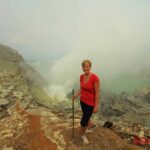 A girl and Ijen crater background view