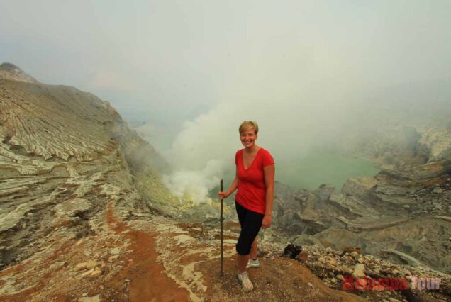 A girl and Ijen crater background view