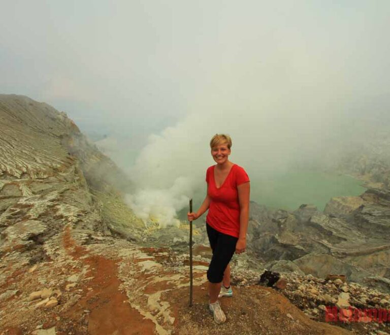 A girl and Ijen crater background view