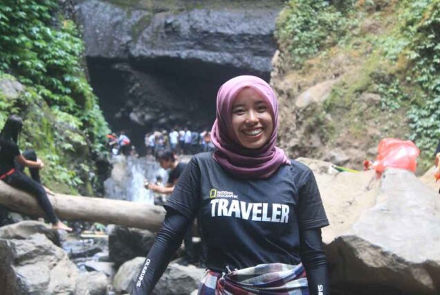 A traveler gilr in Madakaripura waterfall