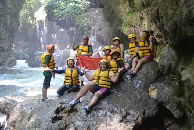 A Group of Traveler while resting from Body Rafting Adventure at Green Canyon