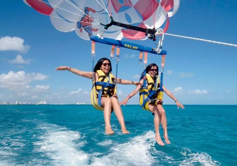 Girls Enjoying Parasailing in Tanjung Benoa Bali